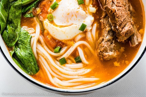 Asian noodles tomato broth soup photo