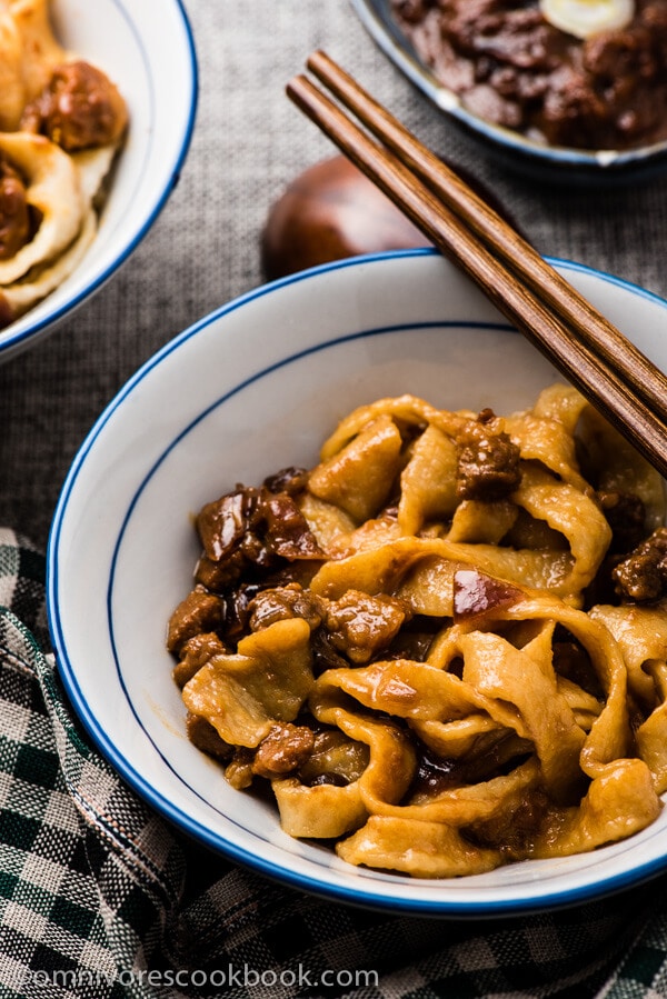 Zha Jiang Mian (炸酱面) - the pork and onion is cooked in a mouthwatering sweet savory sauce, a classic noodle dish of Beijing| omnivorescookbook.com