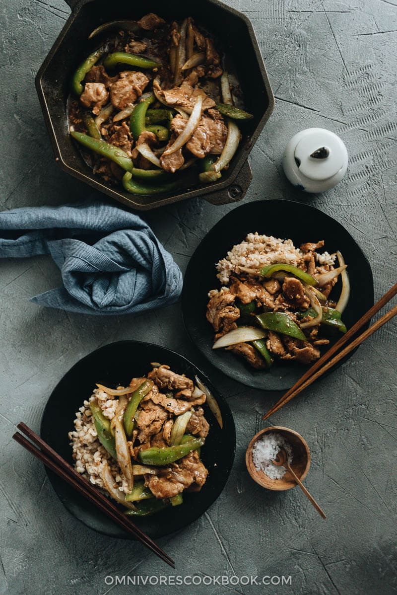 Pork Stir Fry with Pepper served on two plates with rice