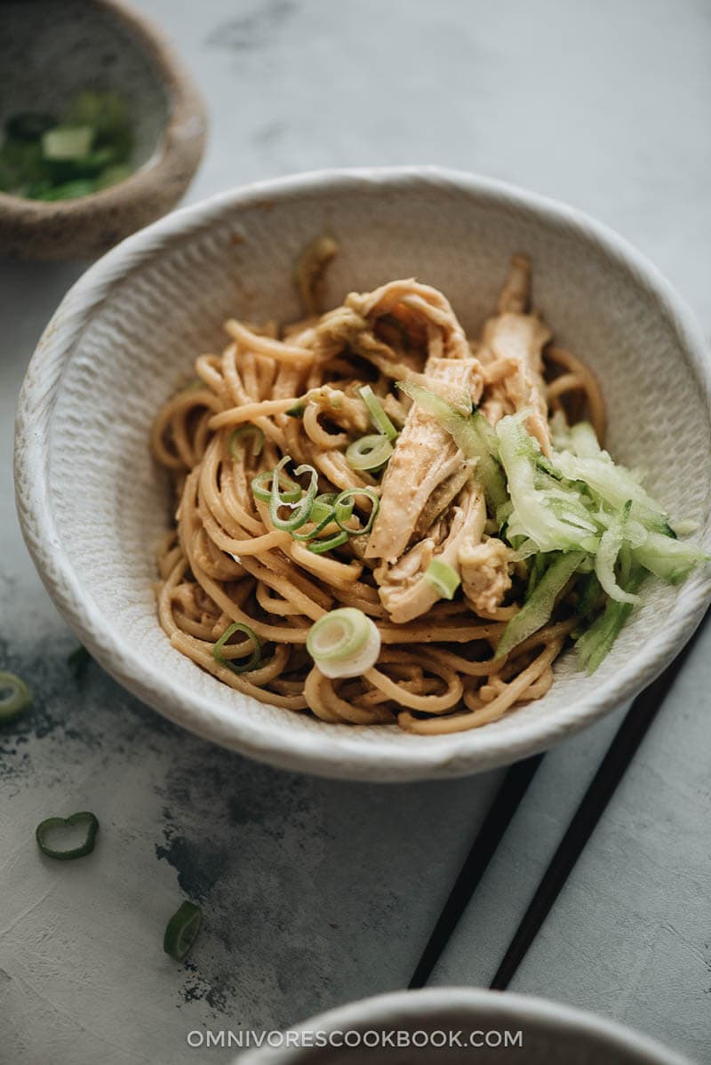 Chinese chicken noodle salad garnished with cucumber