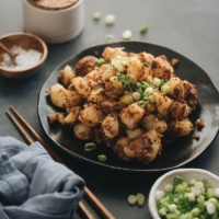 Chinese Sauteed potato - Crispy, tender, buttery potatoes cooked with a bold Asian spice mix. It’s an easy dish to cook and great to serve for breakfast or as a side. #vegetarian #vegan #glutenfree