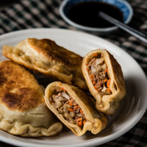 Beef Meat Pie (牛肉馅饼) - A classic northern Chinese pastry. It has a moist savory filling and a crispy crust. It’s a large version of the potsticker and tastes even better! | omnivorescookbook.com