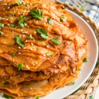 These cheesy kimchi pancakes require minimal prep and only 20 minutes to cook. They also provide a clever way of using up leftovers. Isn’t it a great lunch solution? | omnivorescookbook.com