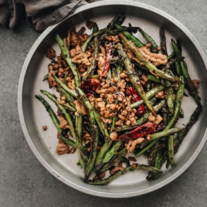 Blistered and charred green beans are tossed with an aromatic sauce, making this dish too good to pass up, and it’s substantial enough to serve as a main. {Vegan Adaptable, Gluten Free Adaptable}