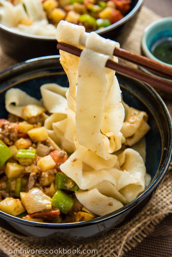 The tender ground lamb meat is cooked with potato, tomato, onion, and pepper to create a simple, colorful, and delectable noodle sauce - Uyghur-Style Noodles with Lamb Sauce (Laghman, 新疆拌面) | omnivorescookbook.com