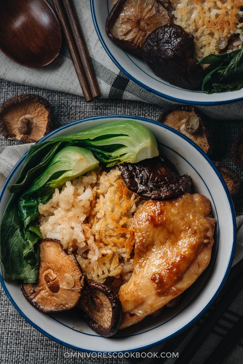 Clay pot chicken with rice, mushrooms, and baby bok choy