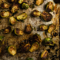 Roasted Brussels Sprouts with Plum Sauce - Learn how to use dried plums and curry powder to make an extra rich plum sauce. | omnivorescookbook.com