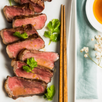 Sous Vide Steak Sashimi with Ponzu Dressing - Sous vide steak yields perfect results every single time. This post introduces the easiest approach, in which the steak is cooked in the oven without special equipment. | omnivorescookbook.com