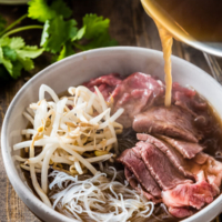 Easy Vietnamese pho noodle soup - Want to get a hearty bowl of Vietnamese pho noodle soup on the table within 30 minutes? Look no further! | omnivorescookbook.com