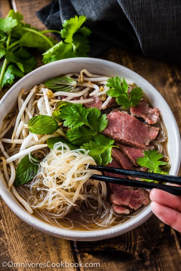 Easy Vietnamese pho noodle soup - Want to get a hearty bowl of Vietnamese pho noodle soup on the table within 30 minutes? Look no further! | omnivorescookbook.com