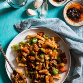 Ding Ding Chao Mian (丁丁炒面) - A hearty fried noodle dish that is cooked with a scrumptious tomato sauce with lamb and peppers. Fast to cook and bold in flavor. A must-have for Xinjiang food lovers.