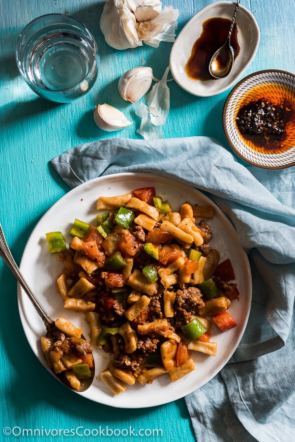 Ding Ding Chao Mian (丁丁炒面) - A hearty fried noodle dish that is cooked with a scrumptious tomato sauce with lamb and peppers. Fast to cook and bold in flavor. A must-have for Xinjiang food lovers. 