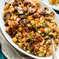 Instant Pot Rice Pilaf - A jambalaya-style rice that is loaded with veggies. You only need 10 minutes to prep, then you can sit back and relax. Your one-dish dinner will be ready in 15 minutes.
