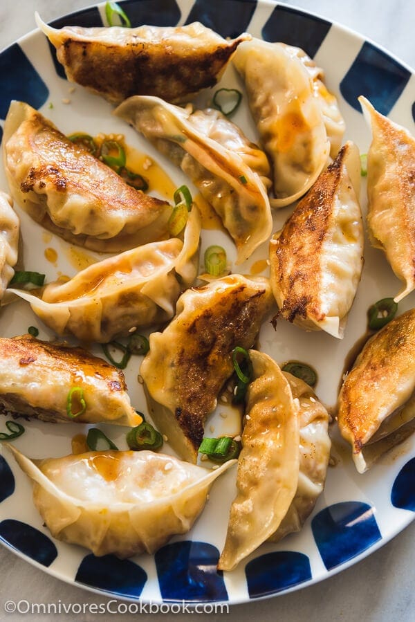 Carrot Dumplings - An elegant vegetarian dumpling that uses carrots, bamboo shoots, mushrooms, and eggs to create a fresh, moist, and rich filling. 