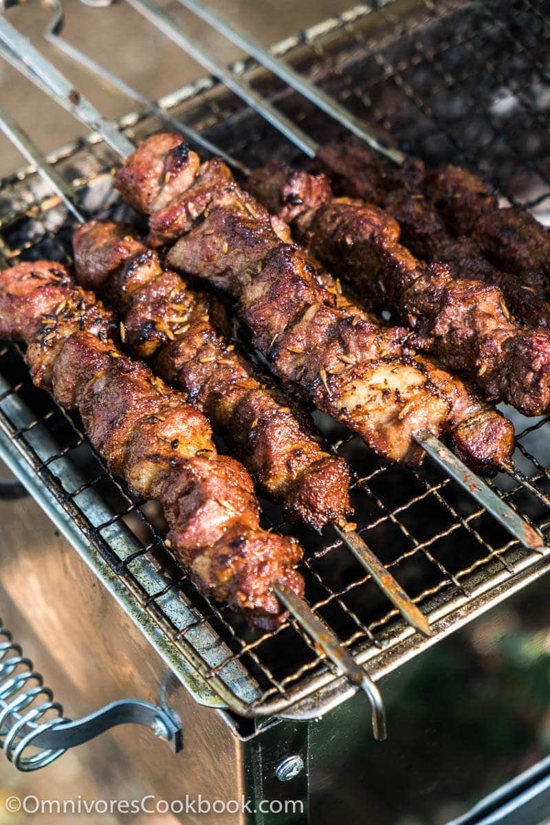 Grill steak on an electric stove. Pork neck fried on small electric grill.  Home cooking. Healthy barbecue. Catering to friends. Electric grilling.  Stock Photo