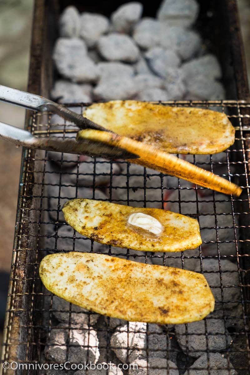 Cook the best grilled potato by slicing it finely, grill until blistered on the surface and creamy in texture. Add cumin and chili powder to spice it up.