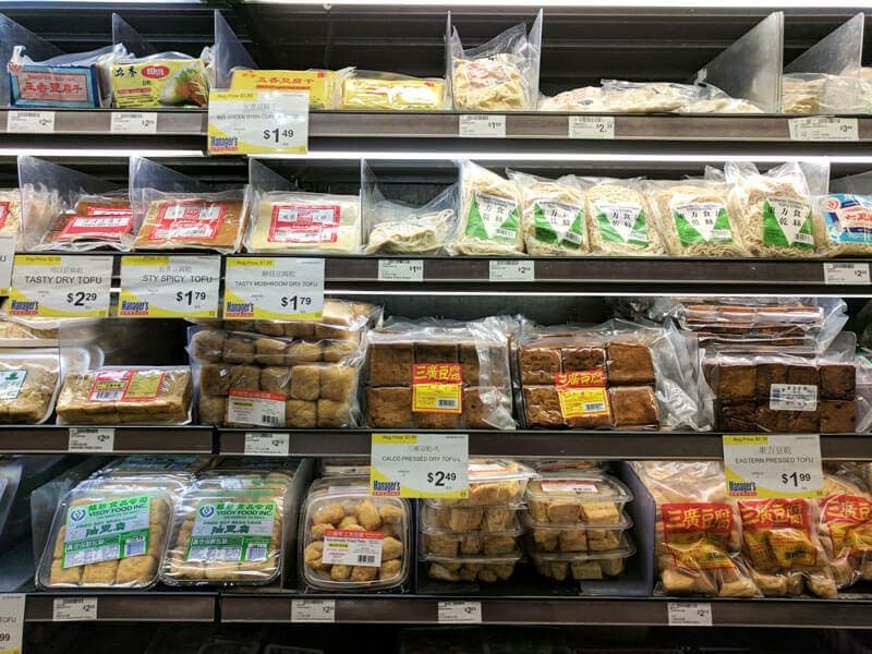 Various tofu products in grocery store