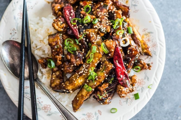 Sichuan eggplant stir fry is incredibly addictive! This is crispy eggplant covered in a sweet, sour, savory and slightly spicy sauce. {vegetarian adaptable}