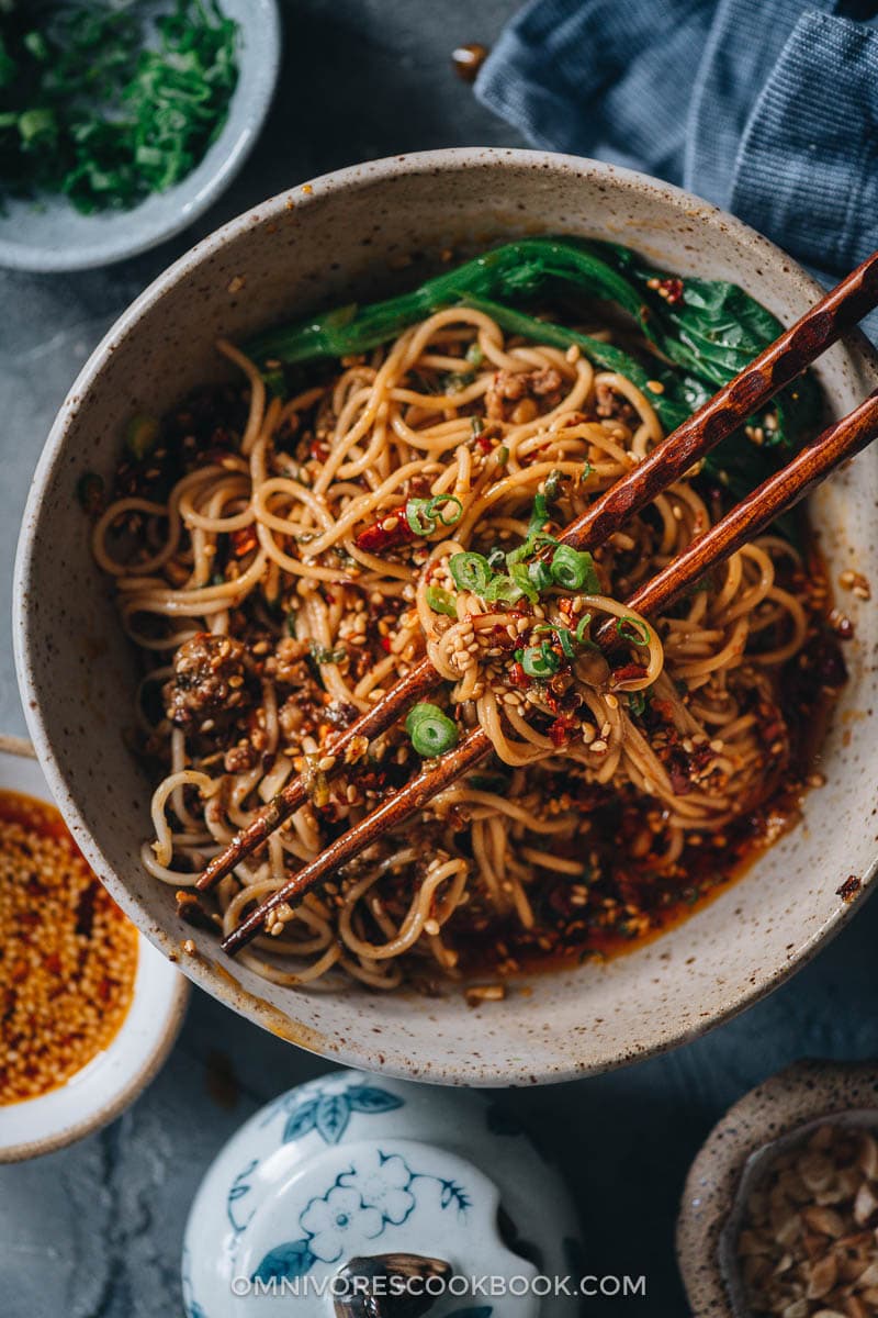 Homemade dan dan noodles with ground pork and greens