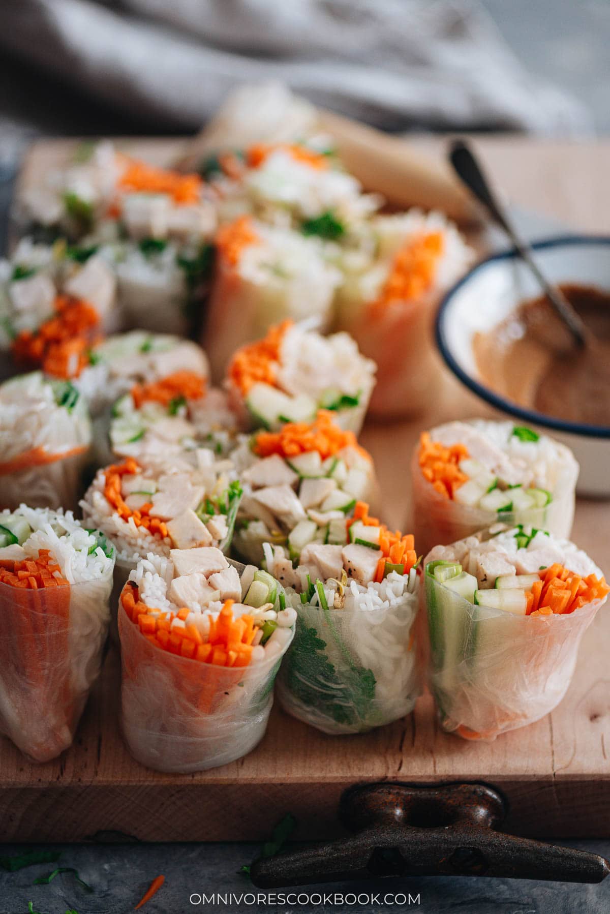 Homemade chicken spring rolls served with peanut sauce