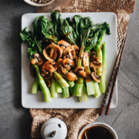 The Chinese broccoli is steamed and served with stir fried mushrooms and a scrumptious brown sauce. It’s a quick and delicious way to put plenty of veggies on your dinner table. {Vegetarian, Gluten-Free Adaptable}
