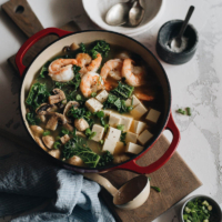 A big pot of shrimp soup with tofu and kale