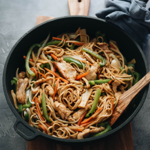 Chicken Lo Mein with peppers, onion, and bamboo shoots close up