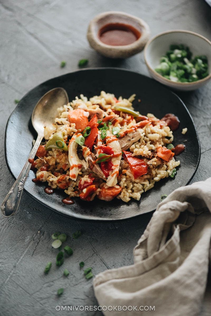 Asian Instant Pot chicken and rice served with Sriracha sauce