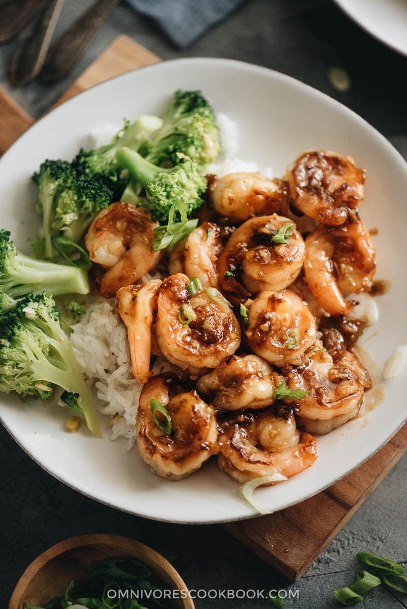 Chinese honey garlic shrimp served with steamed rice and broccoli close up
