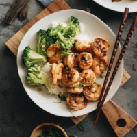 Honey Garlic Shrimp - Learn how to make a healthy honey garlic shrimp stir fry with less sugar and sodium, but more flavor. Serve it on steamed rice with broccoli, and you’ll have dinner ready in 20 minutes! #stirfry #takeout #chinese #easy #glutenfree