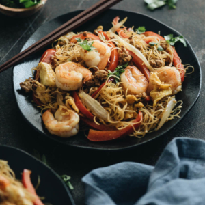 Easy Singapore noodles loaded with shrimp, pork, egg, onion, and pepper.