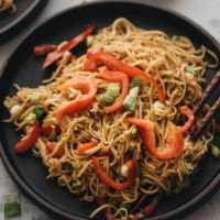These Chinese-style 15-minute garlic noodles are so fast to prepare and perfect for your weekday dinner. The lightly charred noodles are tossed with a rich, savory, gingery, garlicky sauce and a touch of nutty sesame oil. So simple, yet addictively good! {Vegetarian and Vegan adaptable, gluten-free adaptable} #recipes #asian #easy