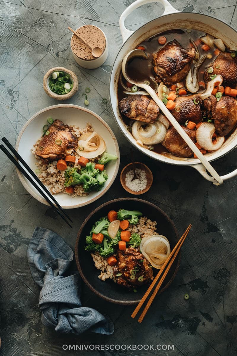 Filipino chicken adobo with onion and carrot served over rice