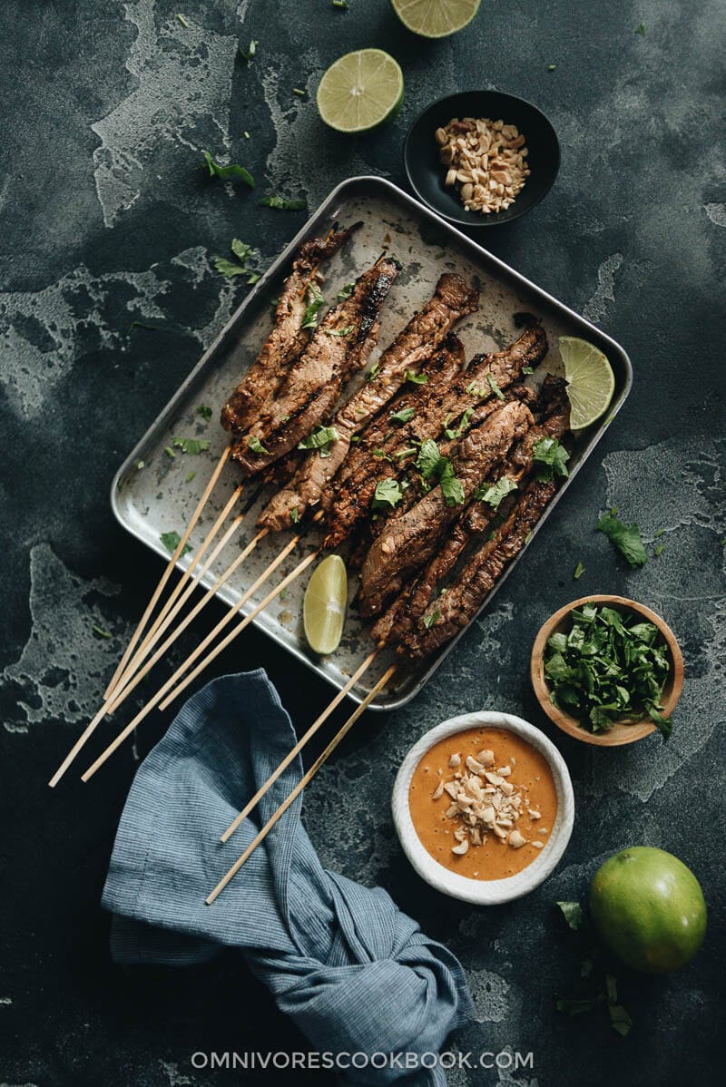 Beef satay served with peanut sauce and cilantro