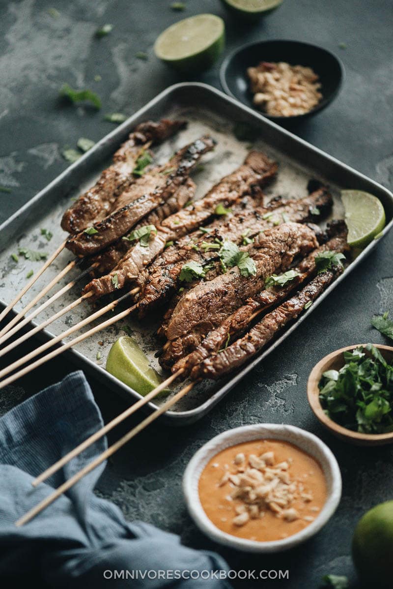 Grilled beef satay served on a tray