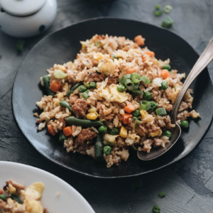 Homemade pork fried rice served with chili sauce