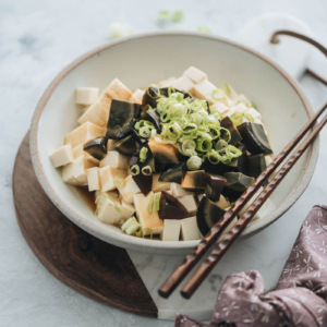 Century egg with tofu salad garnished with green onions