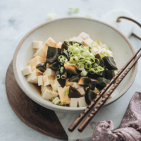 Tofu with Century Egg Salad - A childhood favorite and a popular diner food, the tofu with century egg salad requires just five ingredients and takes five minutes to make. Experiment with this new ingredient if you’re interested in discovering what people eat in China. {Gluten-Free adaptable}