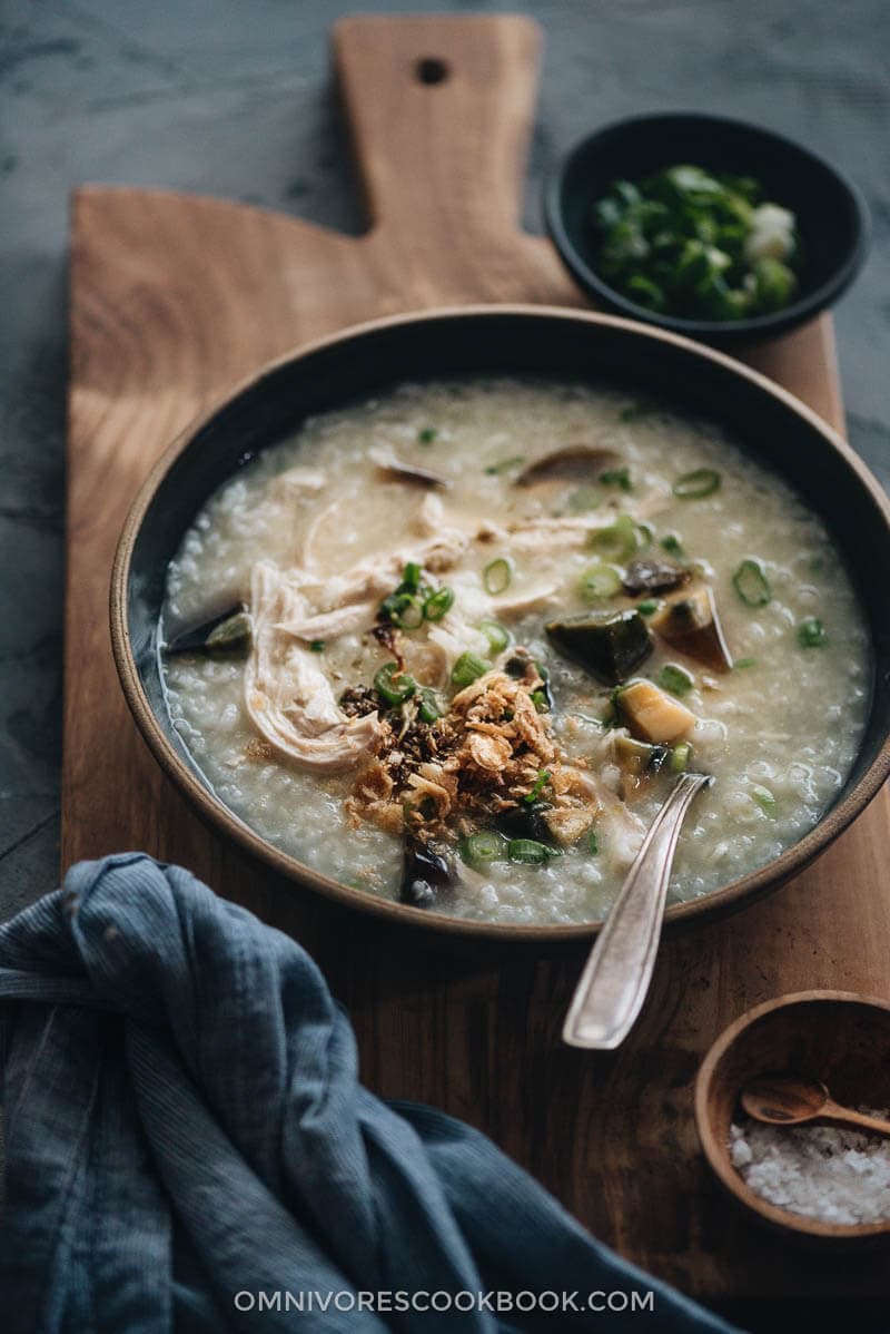 Homemade century egg congee with chicken topped with fried shallot