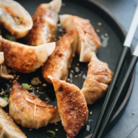 Homemade Vegan Dumplings - The dumpling filling has a well-balanced texture with veggies, tofu, and rice vermicelli. It’s seasoned with plenty of aromatics, soy sauce, and just a dash of curry powder to enhance its richness. #chinese #vegetarian