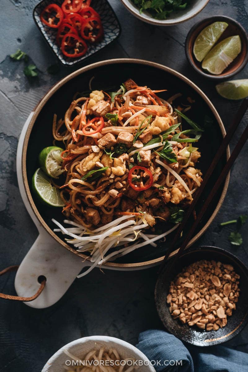 Vegan Pad Thai garnished with bean sprouts and lime