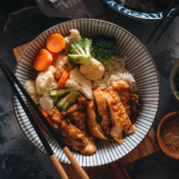 Chinese Yoshinoya style teriyaki chicken served on rice with veggies