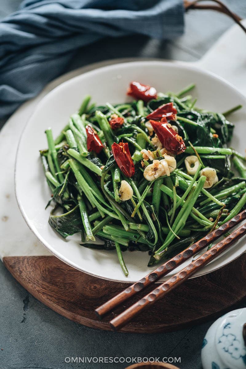 Stir fried water spinach served on a plate