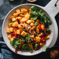 Mango Salad - Sweet and juicy mangoes tossed with lime juice, crispy nuts, crunchy fried onion, and a touch of spice. You can whip up a super-light, revitalizing brunch for the warm weather in no time. {Vegan, Gluten-Free}
