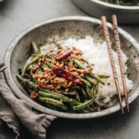 Sichuan Dry Fried Green Beans (干煸四季豆) - Blistered and charred green beans are tossed with an aromatic sauce, making this dish too good to pass up, and it’s substantial enough to serve as a main. {Vegan Adaptable, Gluten Free Adaptable}