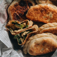 Chinese Chive Pockets (韭菜盒子, Chinese Chive Dumplings) | The super crispy and thin dough is stuffed with a hearty, savory filling made with Chinese chives and scrambled eggs. They’re easier to make than potstickers and have all the goodness that dumplings have, only more satisfying!