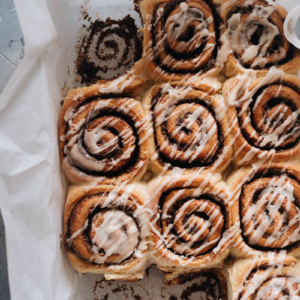 Cinnamon rolls in a pan with glaze