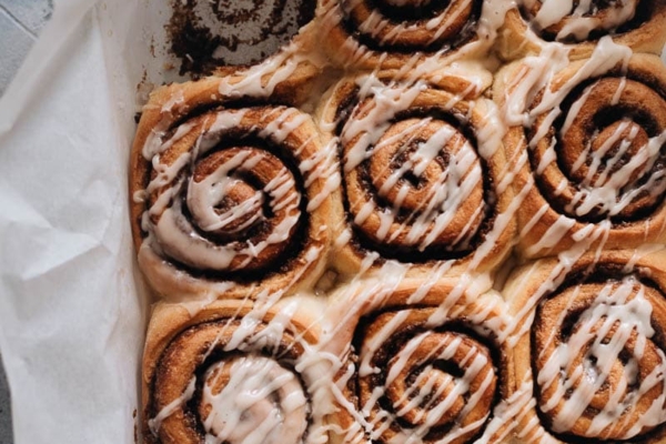 Cinnamon rolls in a pan with glaze