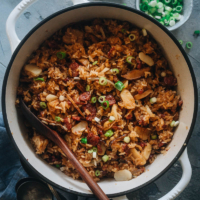 Sticky Rice Stuffing (A Chinese-Inspired Thanksgiving Recipe) | This rich, savory, and buttery sticky rice stuffing is made with sweet Chinese sausage, smoky mushrooms, and crunchy water chestnuts. Cooked with butter, fresh aromatics, and finished up with a drizzle of soy sauce, this hearty stuffing will go well with your regular Thanksgiving dishes while spicing up your dinner party with an exotic touch. {Gluten-Free adaptable}