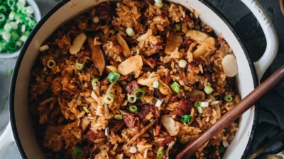 Sticky Rice Stuffing (A Chinese-Inspired Thanksgiving Recipe) | This rich, savory, and buttery sticky rice stuffing is made with sweet Chinese sausage, smoky mushrooms, and crunchy water chestnuts. Cooked with butter, fresh aromatics, and finished up with a drizzle of soy sauce, this hearty stuffing will go well with your regular Thanksgiving dishes while spicing up your dinner party with an exotic touch. {Gluten-Free adaptable}